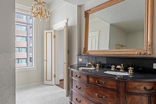 1700 Main St Unit 7B, Houston, TX 77002 - bathroom with a chandelier, vanity, tile patterned floors, and baseboards