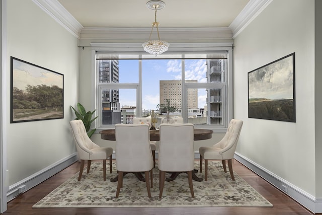 1700 Main St Unit 7B, Houston, TX 77002 - dining space with wood finished floors, a chandelier, baseboards, and crown molding