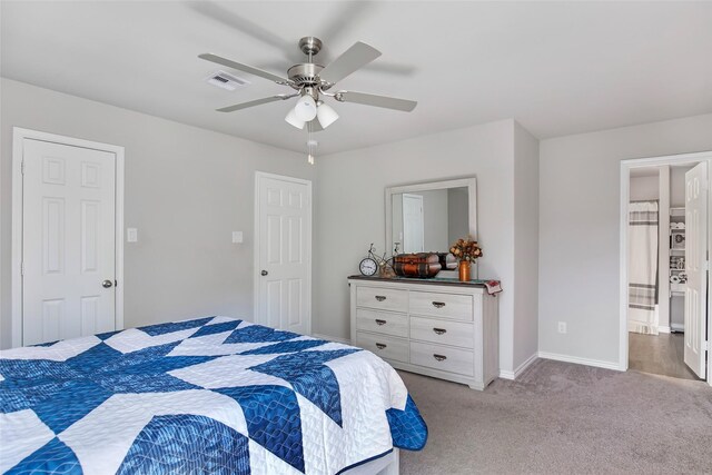 11260 Hodge Rd, Beaumont, TX 77713 - bedroom with light colored carpet, baseboards, ceiling fan, and connected bathroom