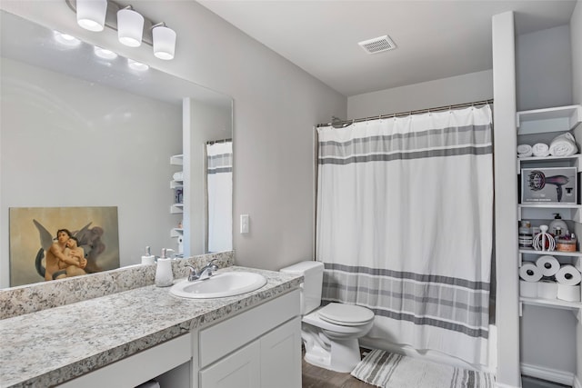 11260 Hodge Rd, Beaumont, TX 77713 - bathroom with wood finished floors, vanity, toilet, and a shower with curtain