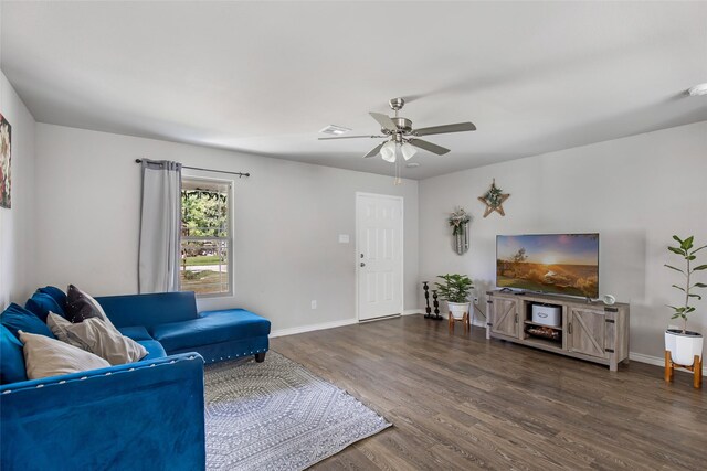 11260 Hodge Rd, Beaumont, TX 77713 - living area with wood finished floors, ceiling fan, and baseboards