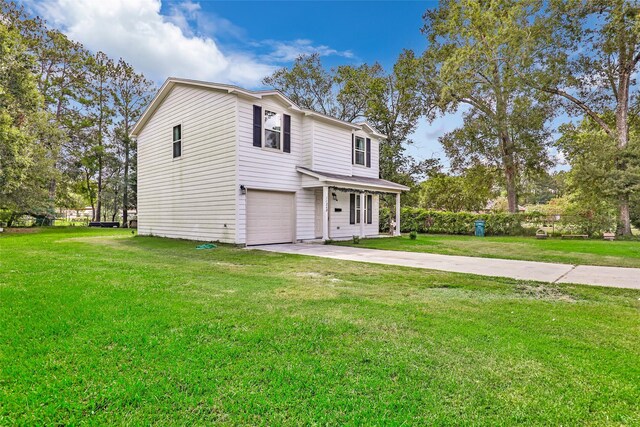 11260 Hodge Rd, Beaumont, TX 77713 - view of front of property with concrete driveway, a garage, and a front yard