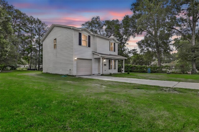 11260 Hodge Rd, Beaumont, TX 77713 - view of front of home featuring concrete driveway, a garage, and a lawn