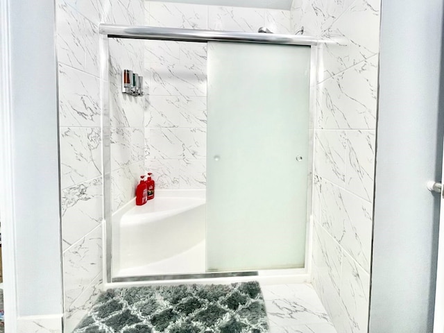 16959 Great Glen Dr, Houston, TX 77084 - bathroom featuring a shower stall and marble finish flooring