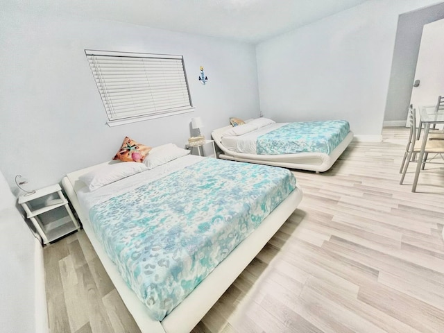 16959 Great Glen Dr, Houston, TX 77084 - bedroom featuring light wood-style floors and baseboards