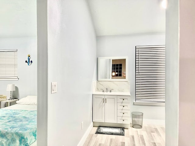 16959 Great Glen Dr, Houston, TX 77084 - bathroom featuring wood finished floors, baseboards, ensuite bathroom, and vanity
