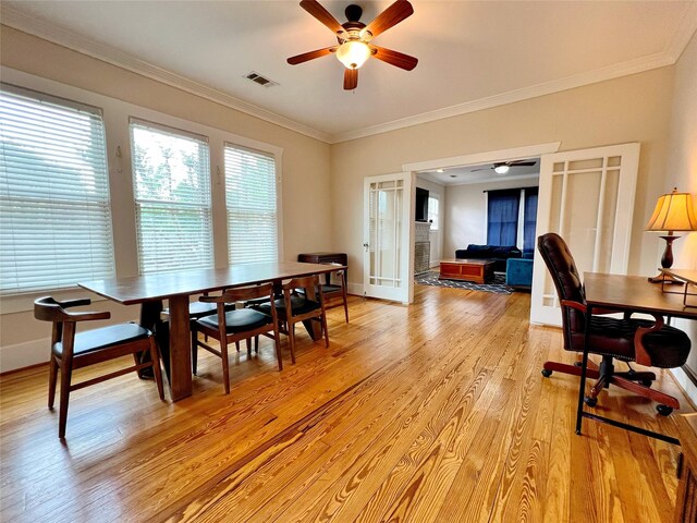 3704 5th St, Brookshire, TX 77423 - dining space with light wood-type flooring, a ceiling fan, crown molding, french doors, and a desk