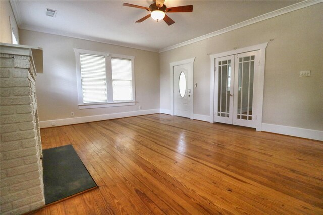 3704 5th St, Brookshire, TX 77423 - unfurnished living room featuring ceiling fan, french doors, ornamental molding, baseboards, and hardwood / wood-style flooring