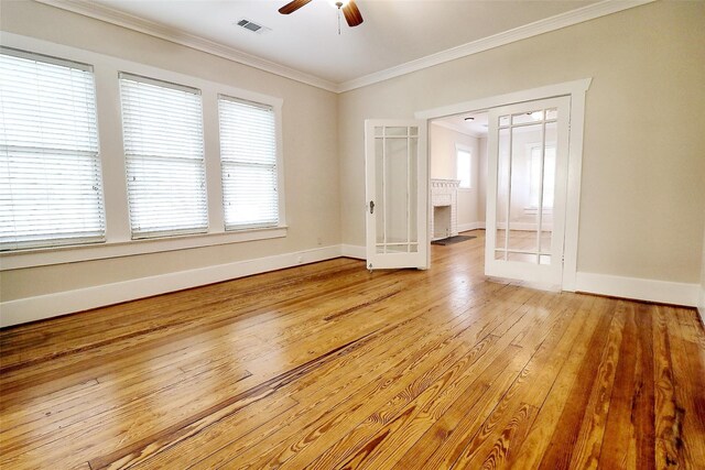 3704 5th St, Brookshire, TX 77423 - unfurnished room with a ceiling fan, crown molding, baseboards, light wood-style flooring, and healthy amount of natural light