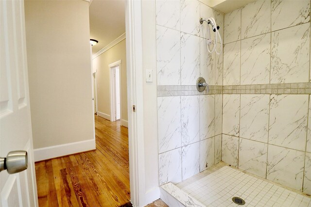 3704 5th St, Brookshire, TX 77423 - bathroom with ornamental molding, a stall shower, and wood finished floors