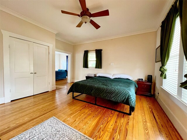 3704 5th St, Brookshire, TX 77423 - bedroom with multiple windows, light wood finished floors, crown molding, and baseboards