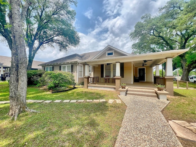 3704 5th St, Brookshire, TX 77423 - view of front of home featuring covered porch, a front yard, and a ceiling fan