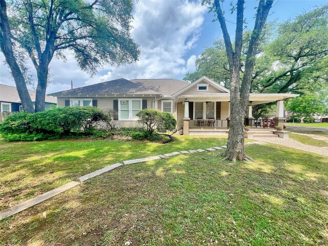 3704 5th St, Brookshire, TX 77423 - view of front of house with a porch and a front yard