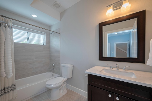 953 Saint Augustine St, Houston, TX 77023 - bathroom featuring toilet, shower / bath combo, vanity, and baseboards