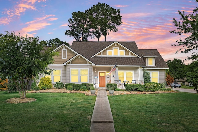 12596 Point Aquarius Blvd, Willis, TX 77318 - craftsman-style home with a front yard, a porch, and a shingled roof