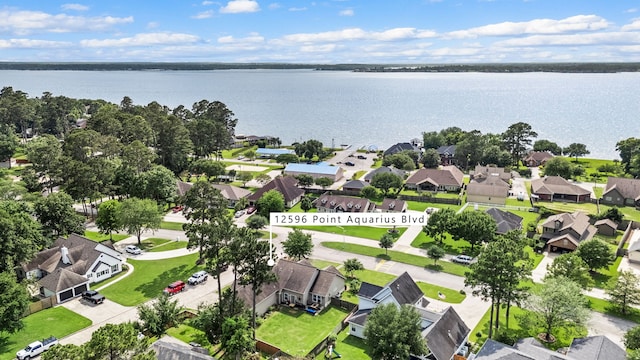 12596 Point Aquarius Blvd, Willis, TX 77318 - aerial perspective of suburban area featuring a nearby body of water