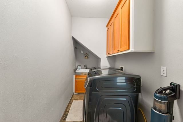 12596 Point Aquarius Blvd, Willis, TX 77318 - laundry area with cabinet space and washer / clothes dryer