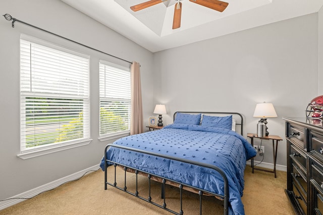12596 Point Aquarius Blvd, Willis, TX 77318 - bedroom featuring light carpet, baseboards, and ceiling fan