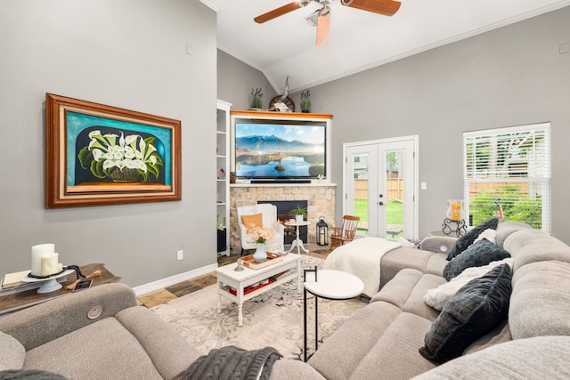 12596 Point Aquarius Blvd, Willis, TX 77318 - living room featuring crown molding, a ceiling fan, french doors, baseboards, and a fireplace