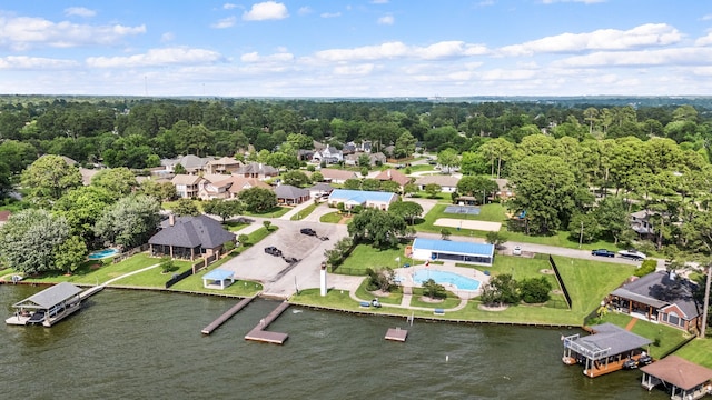 12596 Point Aquarius Blvd, Willis, TX 77318 - aerial perspective of suburban area featuring a nearby body of water and a pool area