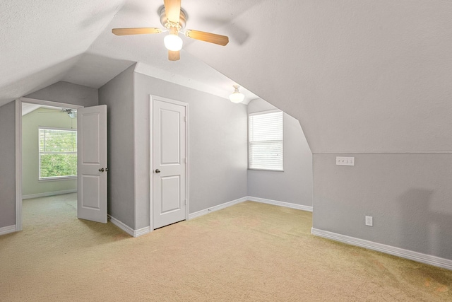 12596 Point Aquarius Blvd, Willis, TX 77318 - bonus room featuring lofted ceiling, ceiling fan, light colored carpet, and baseboards