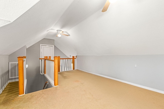 12596 Point Aquarius Blvd, Willis, TX 77318 - bonus room featuring ceiling fan, carpet, lofted ceiling, and baseboards