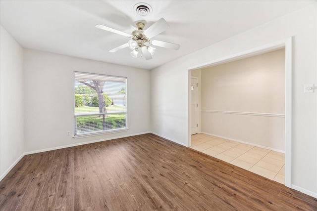 9547 Beverlyhill St, Houston, TX 77063 - empty room featuring wood finished floors, baseboards, and a ceiling fan