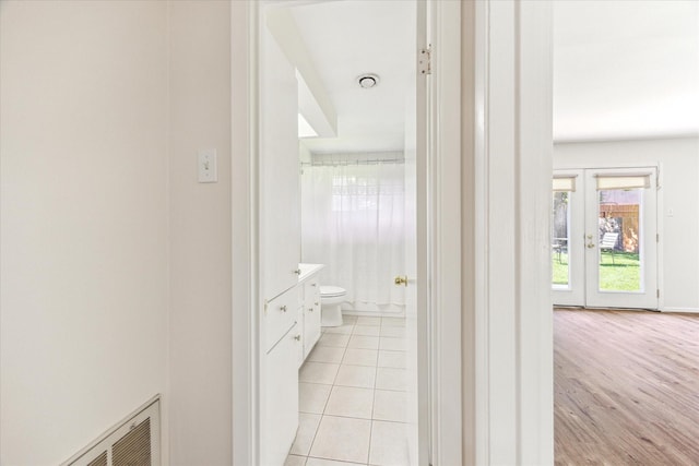 9547 Beverlyhill St, Houston, TX 77063 - bathroom with vanity, toilet, and tile patterned floors