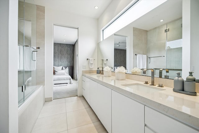 311 Brown Saddle St, Houston, TX 77057 - ensuite bathroom featuring tile patterned flooring, double vanity, a ceiling fan, and recessed lighting