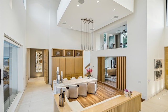 311 Brown Saddle St, Houston, TX 77057 - bedroom with a high ceiling, light tile patterned flooring, recessed lighting, and baseboards
