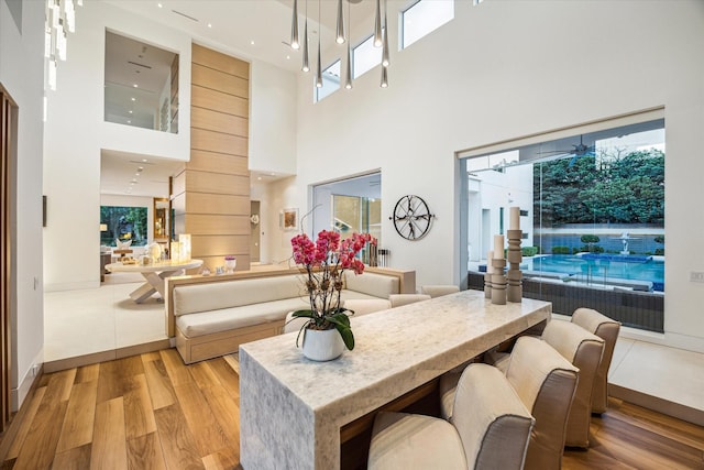 311 Brown Saddle St, Houston, TX 77057 - living room with a high ceiling, light wood-style floors, and recessed lighting
