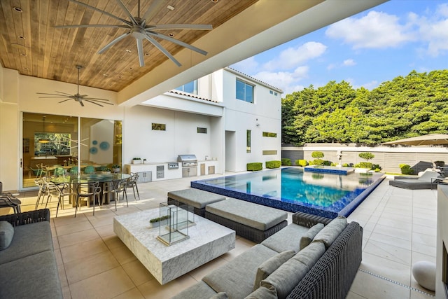 311 Brown Saddle St, Houston, TX 77057 - view of swimming pool with exterior kitchen, outdoor lounge area, a ceiling fan, a grill, and fence