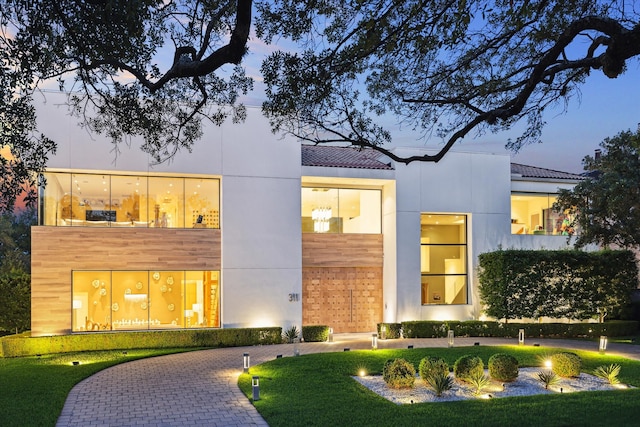 311 Brown Saddle St, Houston, TX 77057 - view of front of property with a tiled roof and stucco siding