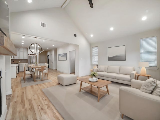3322 Delhi St, Houston, TX 77022 - living area with high vaulted ceiling, light wood-style flooring, recessed lighting, a chandelier, and beam ceiling