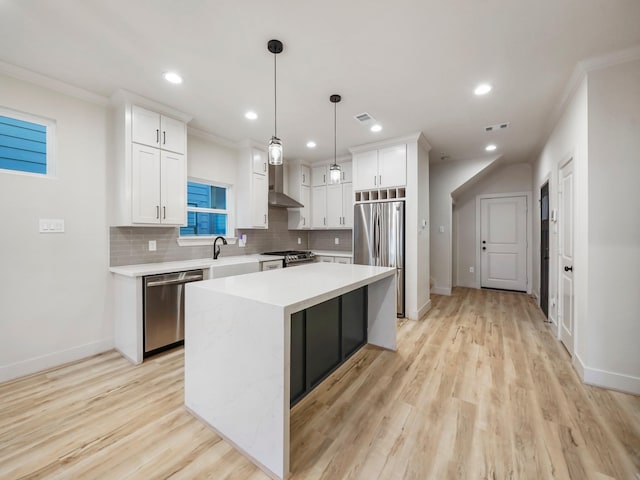 3322 Delhi St, Houston, TX 77022 - kitchen featuring stainless steel appliances, wall chimney exhaust hood, baseboards, light countertops, and white cabinetry