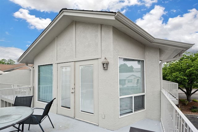 730 E Mather St Unit J-301, New Braunfels, TX 78130 - rear view of property with stucco siding and french doors