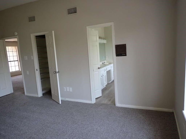 5407 Victoria Dr, Rosharon, TX 77583 - unfurnished bedroom featuring carpet floors, baseboards, ensuite bathroom, and a closet