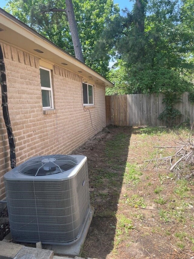 8315 Marble Arch Ct, Humble, TX 77338 - view of yard with central AC unit and fence