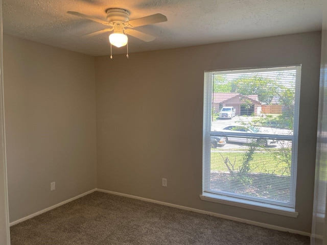 8315 Marble Arch Ct, Humble, TX 77338 - unfurnished room featuring carpet flooring, a textured ceiling, a ceiling fan, and baseboards