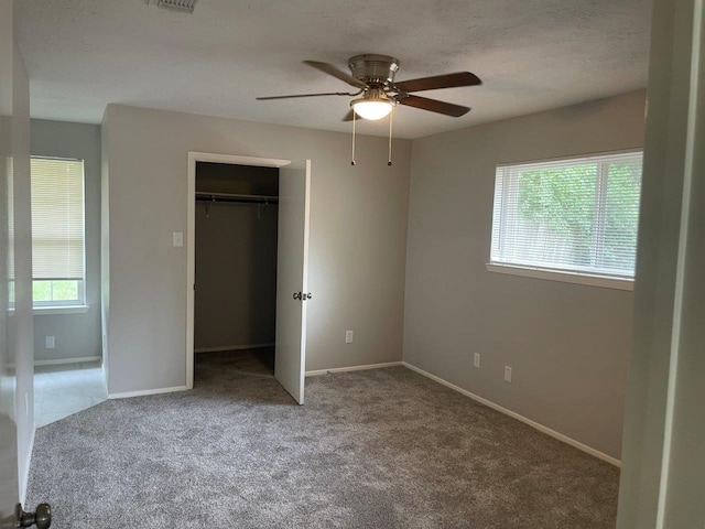8315 Marble Arch Ct, Humble, TX 77338 - unfurnished bedroom featuring carpet floors, baseboards, a closet, and a ceiling fan