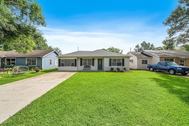 715 S Nugent St, La Porte, TX 77571 - ranch-style home with concrete driveway and a front lawn