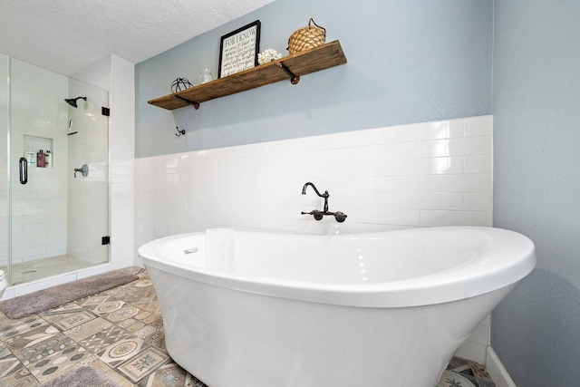 715 S Nugent St, La Porte, TX 77571 - bathroom with a shower stall and a freestanding tub