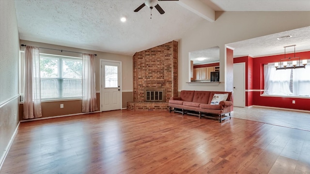 23938 Spring Way Dr, Spring, TX 77373 - living room featuring ceiling fan, wood finished floors, plenty of natural light, and a textured ceiling
