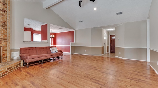 23938 Spring Way Dr, Spring, TX 77373 - living room with ceiling fan, wood finished floors, beam ceiling, high vaulted ceiling, and baseboards