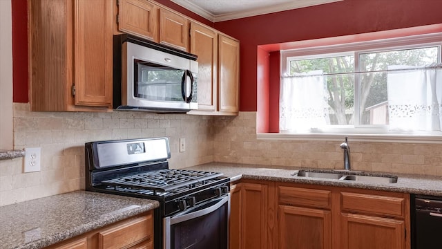 23938 Spring Way Dr, Spring, TX 77373 - kitchen featuring stainless steel appliances, a sink, tasteful backsplash, ornamental molding, and brown cabinetry