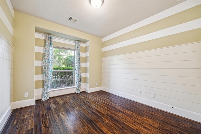 7930 Rippling Stream Ln, Richmond, TX 77407 - spare room with baseboards and wood-type flooring