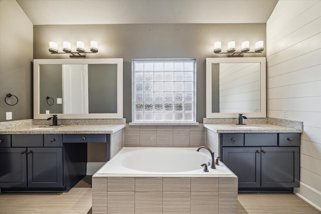 7930 Rippling Stream Ln, Richmond, TX 77407 - bathroom with a garden tub and two vanities
