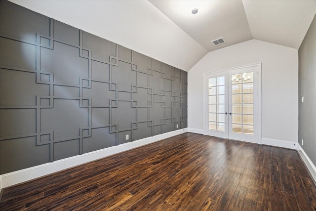 7930 Rippling Stream Ln, Richmond, TX 77407 - empty room with wood-type flooring, baseboards, vaulted ceiling, and french doors