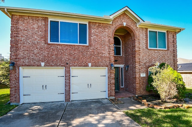 323 Cape Conroe Dr, Montgomery, TX 77356 - traditional-style house with driveway, an attached garage, and brick siding