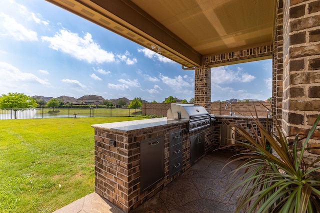 11702 Saporito Way, Richmond, TX 77406 - view of patio with a water view and a sink